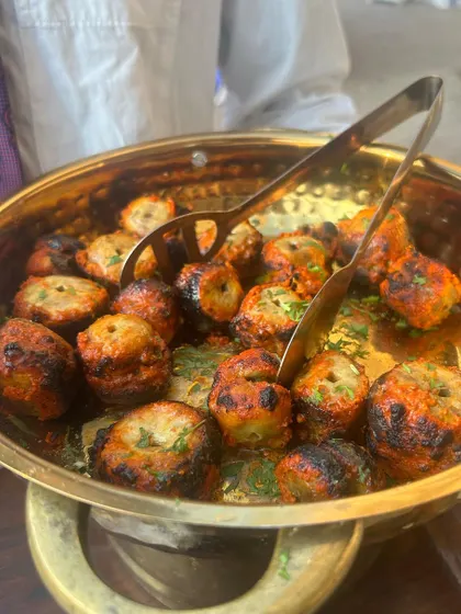Tandoori Mushroom Tikka, fresh from the grill. These are marinated in spices and yogurt for a smoky, tangy flavor.