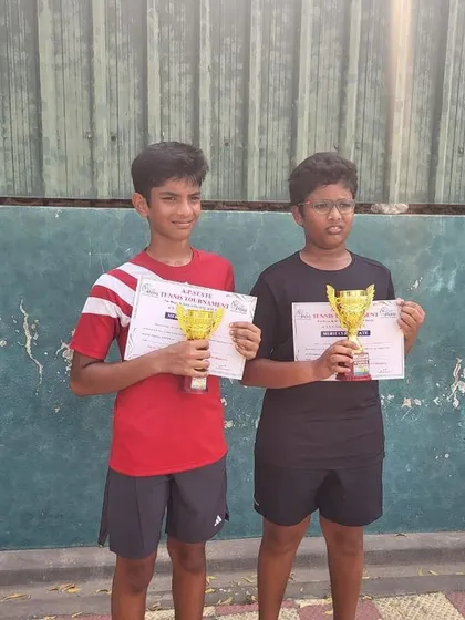 Adith and Hitesh celebrating their win at the U14 state championship tennis tournament. We foster a competitive yet supportive environment for our players.