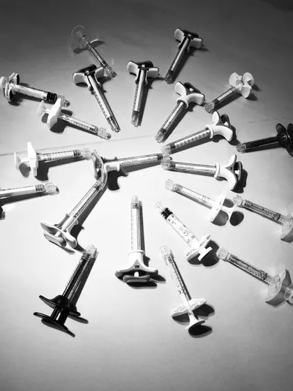 A collection of dermal filler syringes. I believe in working with all available brands to understand their unique properties, which allows me to choose the best product for each patient and teach these nuances to my trainees.