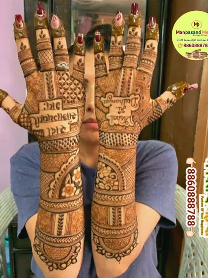 A beautiful back-of-hand design with the blessing 'Sada Saubhagyavati Bhava' and the groom's name 'Rahul'. This is a traditional and meaningful choice for a bride.