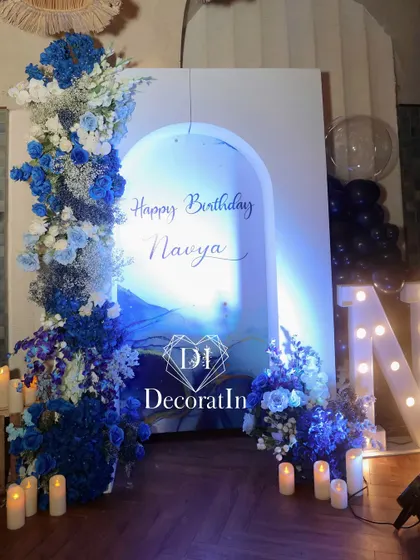 The blue-themed backdrop illuminated with a soft blue light, creating a dreamy and ethereal mood for evening photos.
