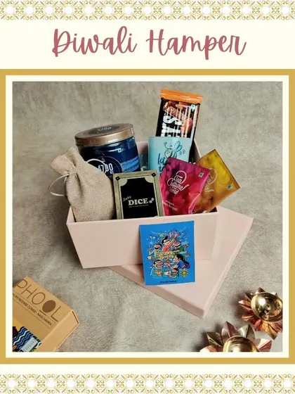 A fun-filled Diwali hamper that includes a party game, assorted teas, a scented candle, and other goodies. It's perfect for celebrating the festival with friends.