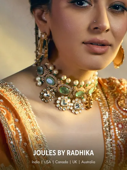 A detailed shot of the pastel green and polki choker on Hansika Motwani, highlighting the delicate craftsmanship.
