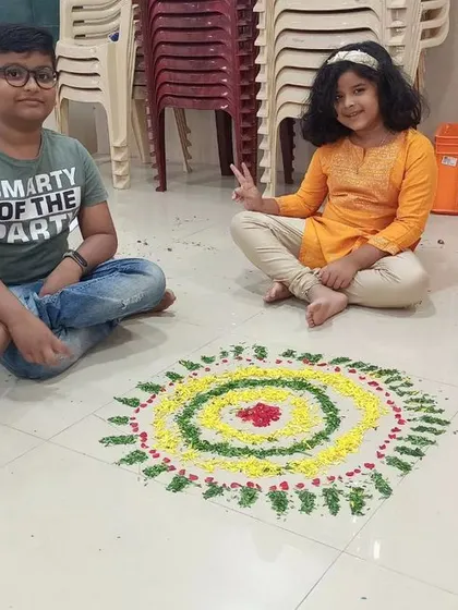 Another proud group with their colourful masterpiece. These hands-on activities are a fantastic break from dance practice and help build a strong sense of community.