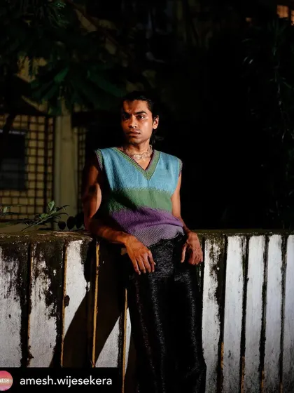 Another look from the Amesh Wijesekera editorial. The grooming is consistent and clean, ensuring the model looks polished and sharp under the dramatic nighttime lighting.