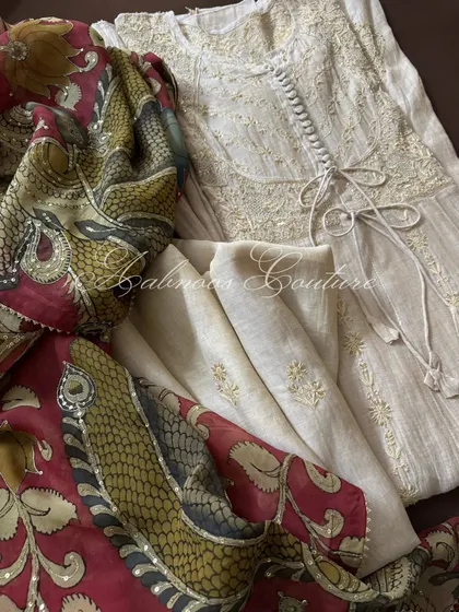 A close-up view of the ensemble, focusing on the intricate details of the Kalamkari peacock motif, which is further embellished with subtle sequins.