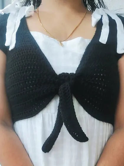 A close-up of the shoulder bows and the simple, elegant design of the Mari Top.