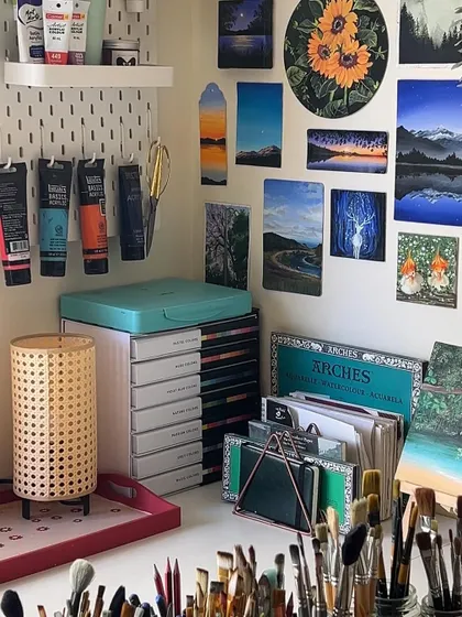 A closer look at my art supplies, with my paint tubes and brushes neatly organized. A tidy space helps me have a clear mind.