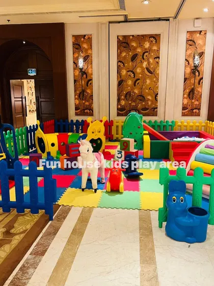 A full view of the rainbow play area from the side, showing all the different play elements.