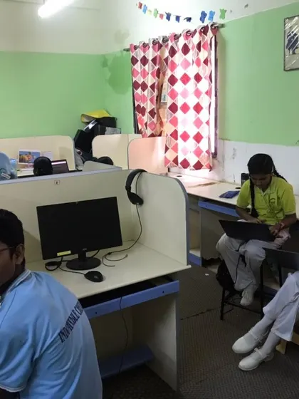 Students work on their laptops in individual cubicles during an AI and Python workshop at Cee Dee Yes Public School.