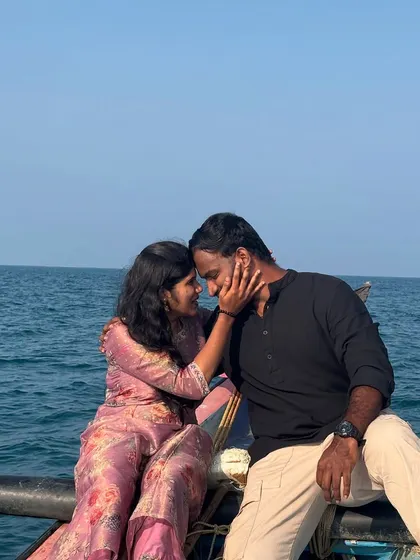 A romantic moment captured during a mid-sea boat experience. The open water provides a stunning and intimate setting for couples.