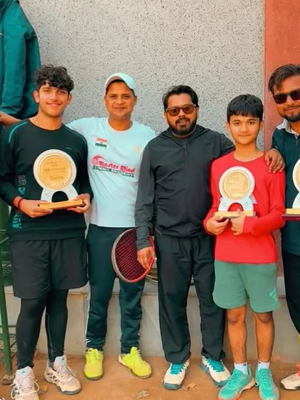 A group of our tournament winners and participants with the coaching staff. We celebrate everyone's hard work and participation.