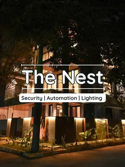 The stunning exterior of "The Nest" project at night, with automated lighting creating a safe and welcoming ambiance.