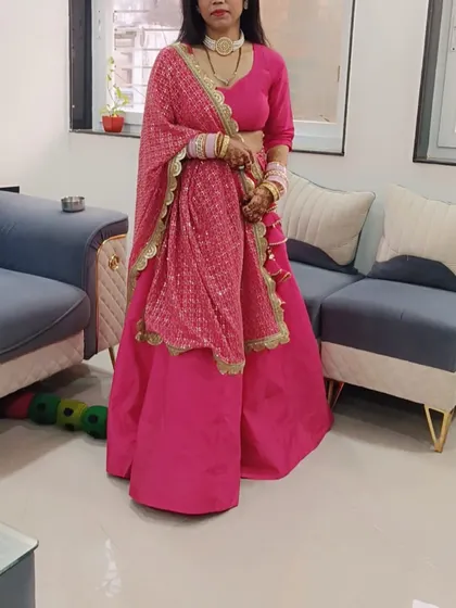 A client looking lovely in a custom pink lehenga I designed for her. The simple, elegant skirt is paired with a sequined dupatta with a scalloped border, perfect for a wedding function.