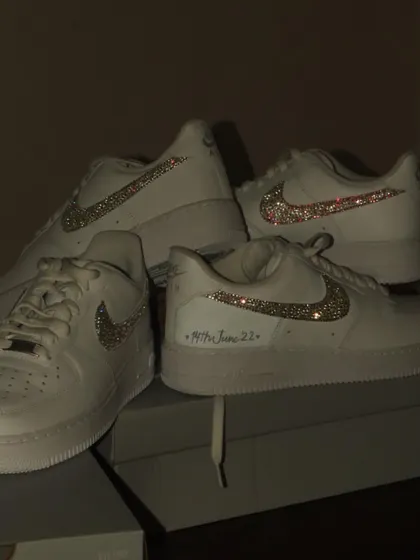 Iced out Forces. For this project, I customized two pairs of Nike Air Force 1s for a client by carefully applying sparkling crystals all over the swoosh, and adding a special date.