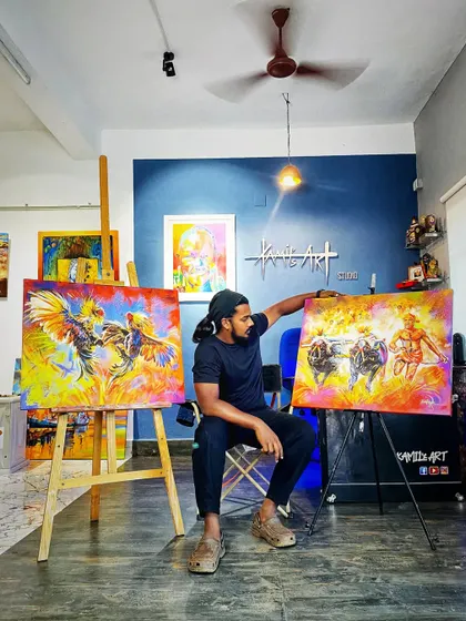 Here I am in my studio with two of my proudest creations celebrating Tulunadu culture. On the left is the 'Koroda Katta' and on the right is my 'Kambala' painting, both ready to find a new home.