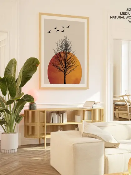 This minimalist print captures the serene beauty of a winter sunrise, with a dark silhouette of a tree against a warm, glowing sun. It's a peaceful and evocative piece that brings a sense of calm to any modern living space.