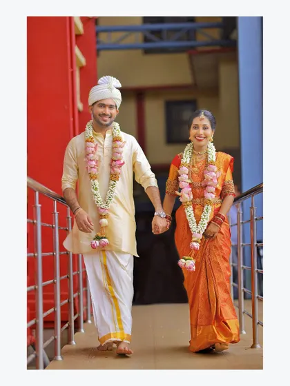 A joyful walk together after the ceremony. This candid shot captures the pure happiness and beginning of a new journey for the couple.