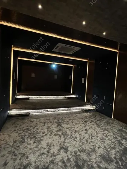 A look at the architectural foundation of a great home theater. The clean lines and dark, non-reflective surfaces are purposefully designed to enhance both the audio and visual performance of the room.
