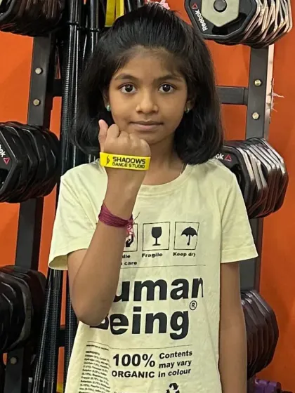 Aaradhya shows her new yellow band, earned for her top performance in the basic level. Well done.