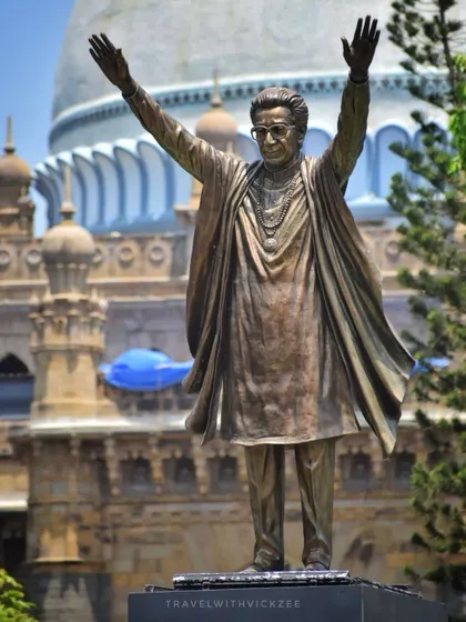 The Balasaheb Thackeray statue with the dome of the Chhatrapati Shivaji Maharaj Vastu Sangrahalaya (museum) in the background, linking two Mumbai icons.