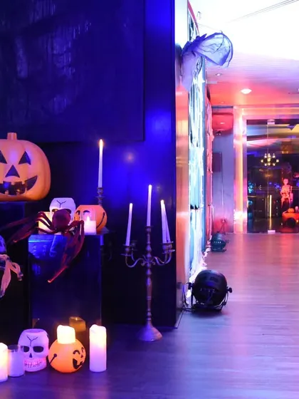 Another corner of the Halloween event, with skulls, candles, and spooky lighting. Every detail was curated to contribute to the immersive and fun horror theme.