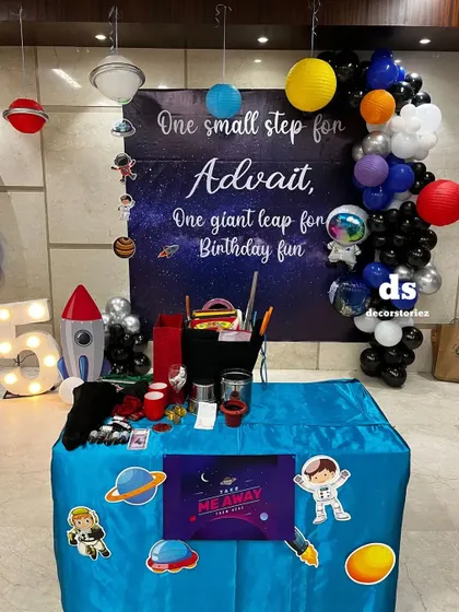 A detailed look at the space-themed party table. I can provide themed elements for every part of your event, including custom signs for party favors.