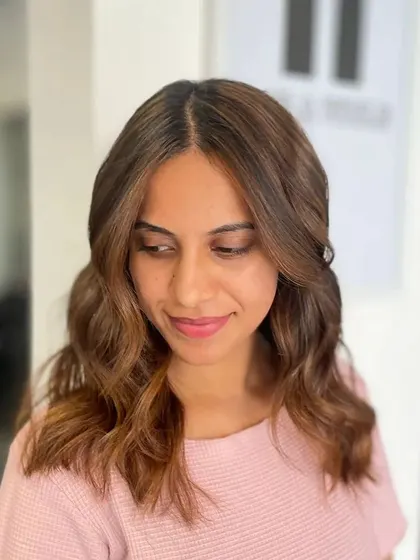 Another portrait, capturing the joy of a fresh hairstyle.