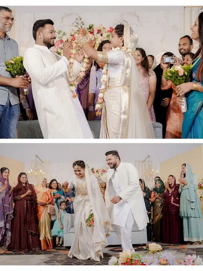 A fun and lively moment from the wedding ceremony, where the bride playfully places the garland on the groom, surrounded by laughing family members.