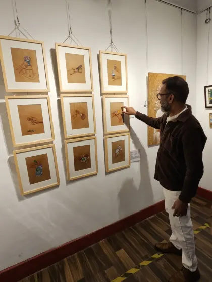 A visitor pointing out details in one of my drawings. These interactions are incredibly valuable and encouraging for me as an artist.