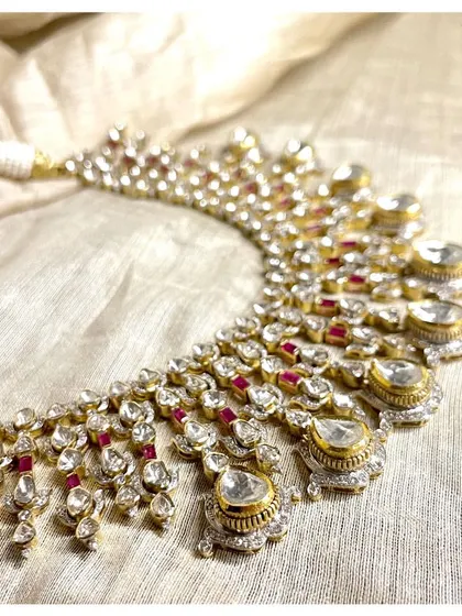 Every detail of this necklace is a work of art. A symphony of diamonds and rubies, this piece is a celebration of light and color, designed for the most special occasions.