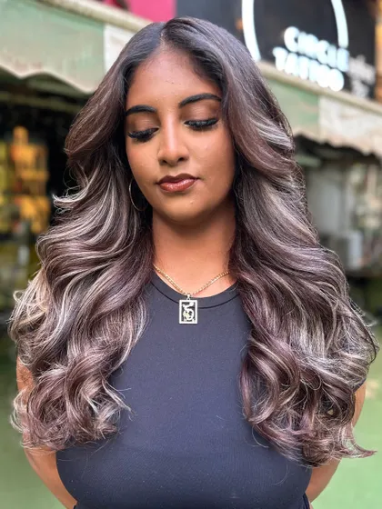 A gorgeous blonde transformation with cool, ashy undertones. We created this look with careful lightening and toning to achieve a sophisticated and modern blonde.