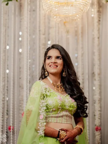 An engagement bride looking radiant in lime green. We gave her a soft, pretty makeup look with a pop of pink on the eyes to complement her vibrant outfit. ✨🤍