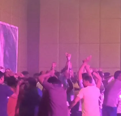 A moment of coordinated dancing at the corporate meet.