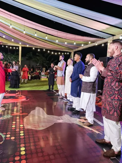 The Sangeet is a time for friends and family to shine. We set up a dedicated performance stage with a custom floor, giving everyone the perfect platform to dance their hearts out and celebrate the couple.