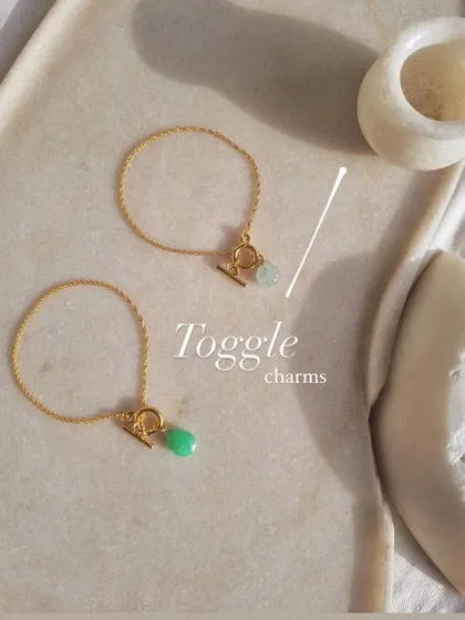 My toggle charm bracelets are designed for simple, everyday wear. This photo shows the 'nárūra' bracelet with an aquamarine charm for calm and the 'aṃahú' bracelet with a chrysoprase charm to help heal a broken heart.