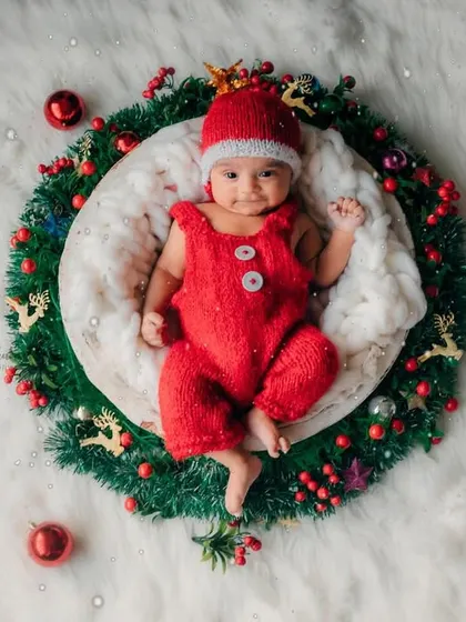 An overhead shot of the complete Christmas wreath setup. It's a unique and festive way to capture your baby's first Christmas.