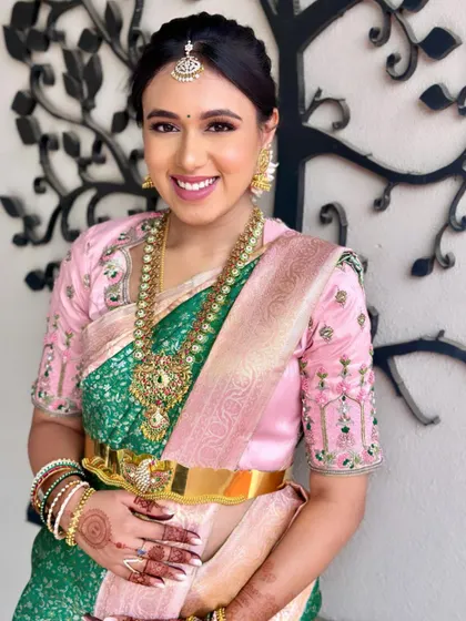 Dr. Niharika looking absolutely stunning for her baby shower. The combination of her green and pink saree with fresh, dewy makeup created a truly memorable look.
