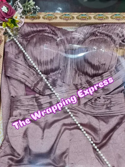 A modern, strapless gown packed in a traditional print box. This shows how I can mix different styles to create a unique look for your trousseau packing needs.