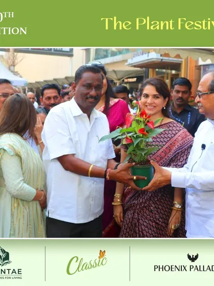 Gifting a plant is a gesture of growth and goodwill. Here, we are sharing a moment with our supporters during the festival's inauguration.