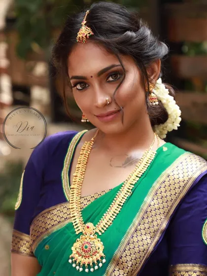 A beautiful portrait of a bride with a natural makeup look. Her skin looks fresh and dewy, and her eyes are gently defined to make them pop. This style is for the bride who wants to look like herself, just elevated for her special day.