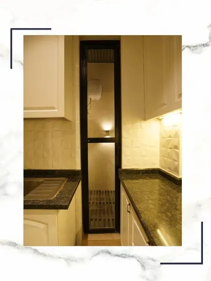 Where gourmet dreams meet timeless design. This utility area off the kitchen shows our commitment to quality, with durable granite countertops and practical storage solutions.