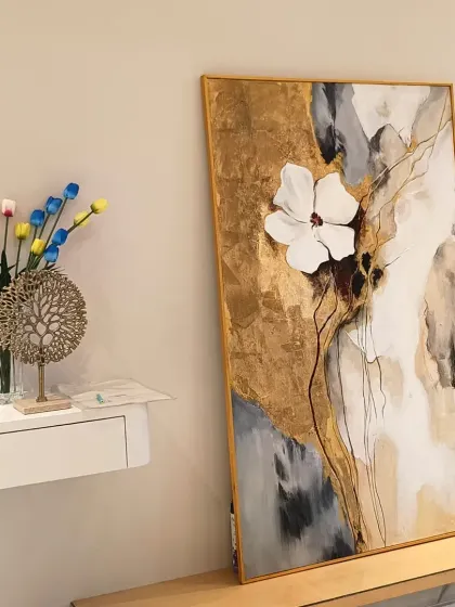 Art should complement your space. This modern abstract painting, featuring a textured 3D flower and gold leaf accents, is designed to add a touch of elegance and sophistication to contemporary homes.