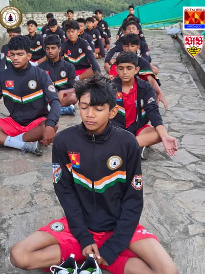 Lined up in perfect discipline, our players practice mindfulness. This training helps them stay calm under pressure during crucial moments in a match.