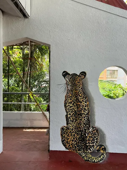 The way the leopard is positioned next to the doorway makes for a fun surprise.