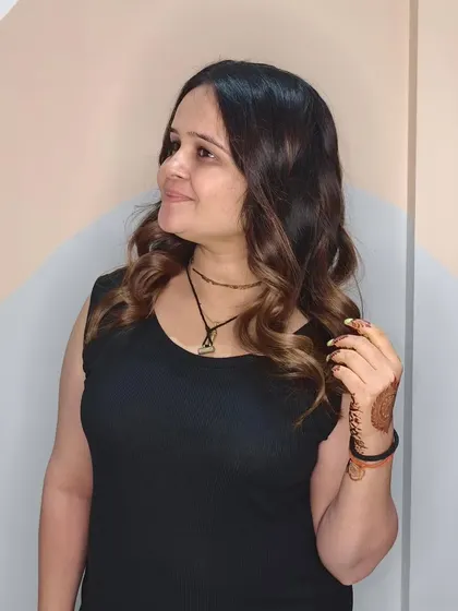 Another angle of the beautiful golden tong curls, perfect for adding a touch of glamour to any look.