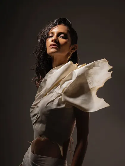 An editorial shoot for the brand Kachiwala. This look is all about wet, glowing skin and a raw, sculptural feel that complements the unique fashion.