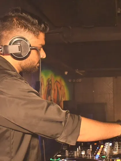 A side profile shot of me concentrating on the mix at Ludo Kitchen and Lounge.