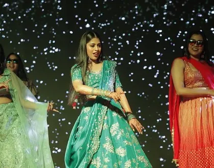A fun moment from a bridesmaids' performance. We make sure our choreography is full of energy and personality.