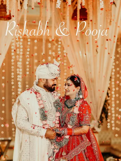 A romantic wedding portrait of the couple, with a shower of petals adding a touch of magic to their loving gaze.